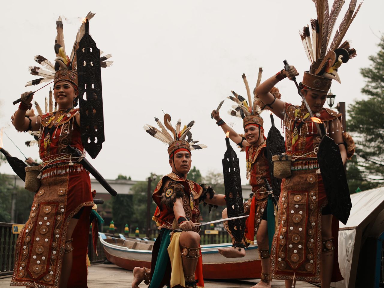 Vibrant performance of Dayak dancers in traditional attire, showcasing cultural heritage in Jakarta.